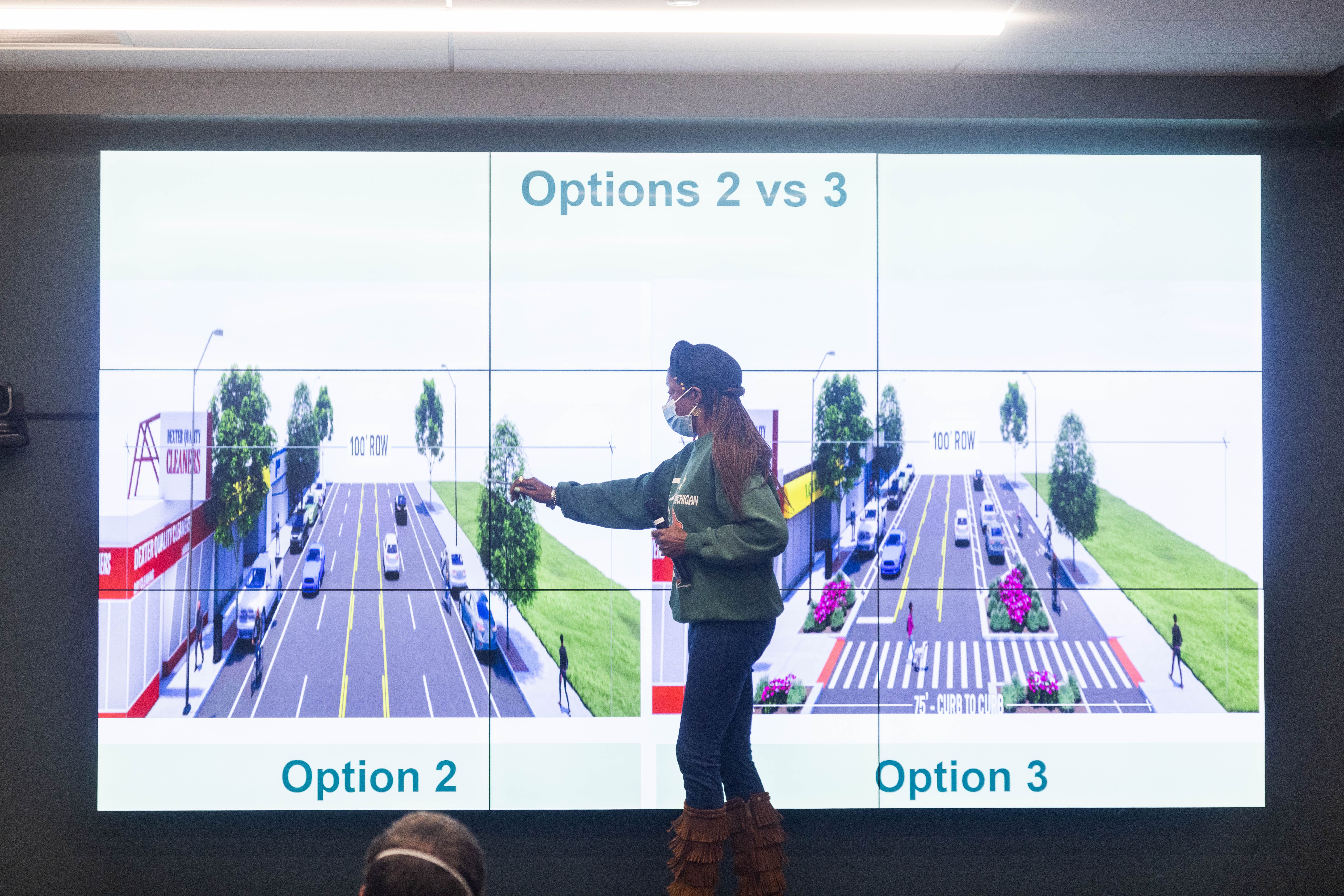 Dexter Ave. Streetscape meeting 1 woman on stage